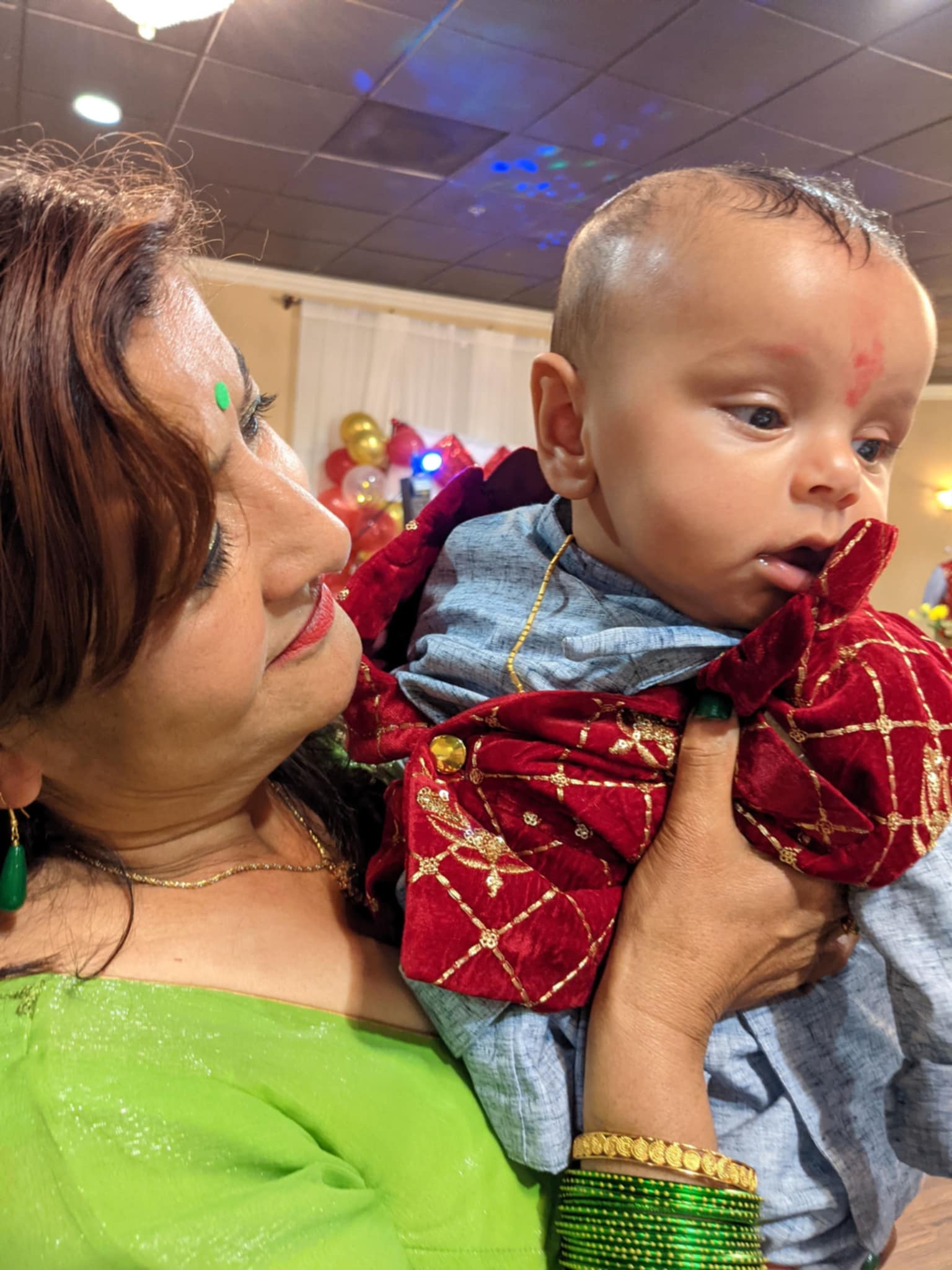 Neeta holding a toddler